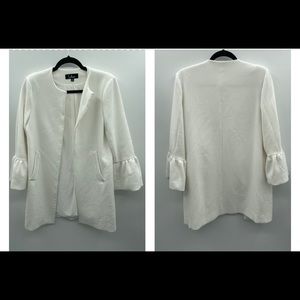 Lulus white open front mid length jacket with 3/4 ruffle sleeves